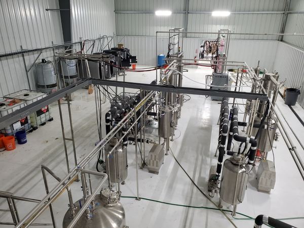 Extraction hall with stainless steel process skids